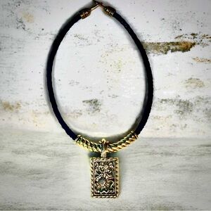 Retired Brighton. Gold toned engraved Floral w/ braided leather chain